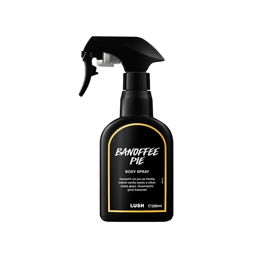 A black spray bottle of Lush 'Banoffee Pie' body spray. The label features white text with a yellow border. The bottle has a trigger spray nozzle and contains 200ml of product.
